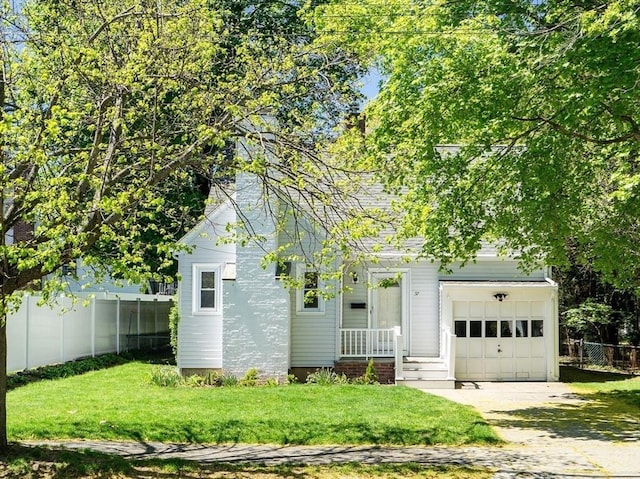 view of front of property featuring an attached garage and driveway