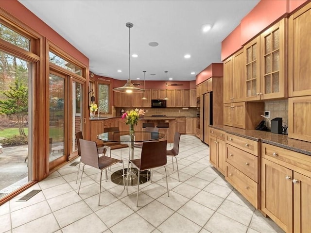 dining area featuring visible vents, plenty of natural light, and light tile patterned floors