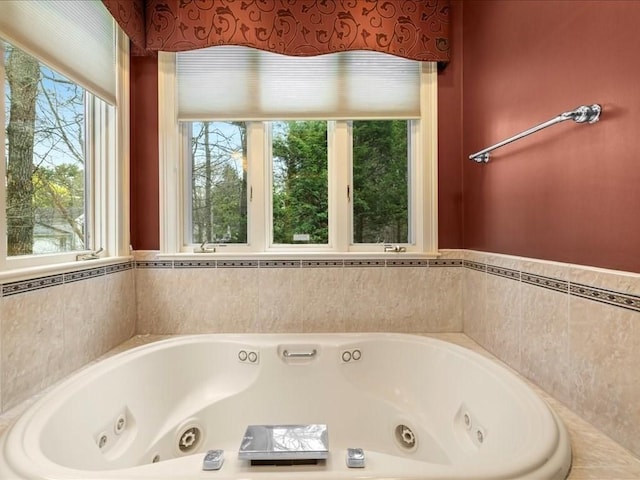 full bathroom featuring a whirlpool tub
