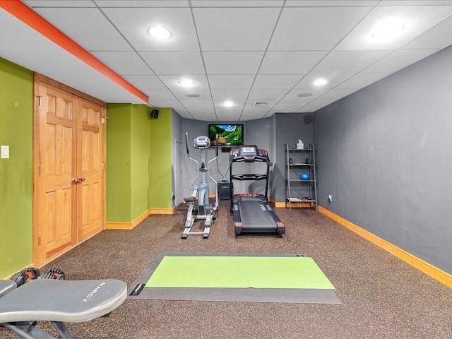 exercise area featuring carpet floors, recessed lighting, and baseboards