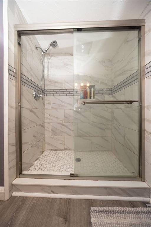 full bath with a shower stall