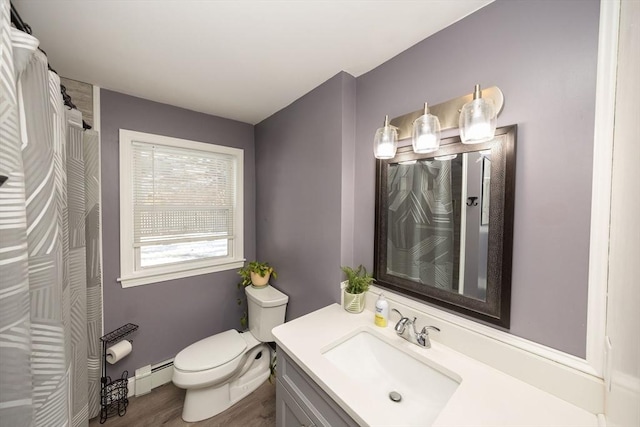 full bathroom featuring baseboards, toilet, curtained shower, baseboard heating, and vanity