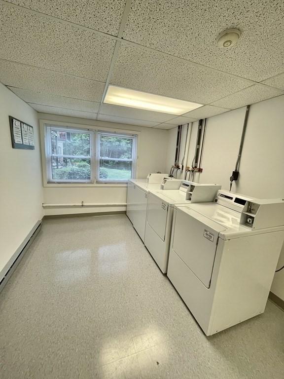 610 S Franklin St Unit F301, Holbrook, MA 02343 - community laundry room with washer and dryer and a baseboard heating unit