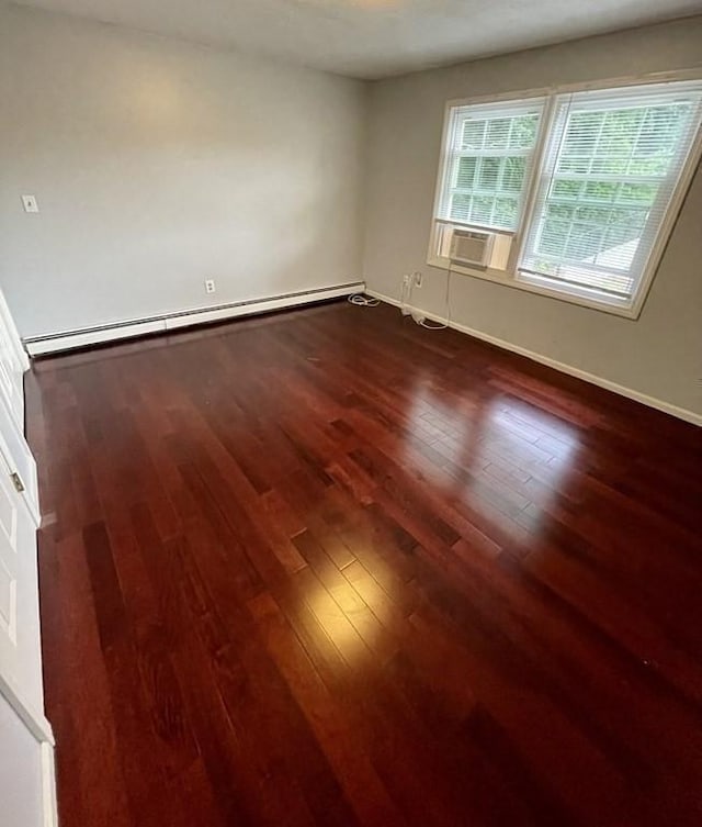 610 S Franklin St Unit F301, Holbrook, MA 02343 - unfurnished room featuring a baseboard radiator, dark wood-type flooring, and cooling unit