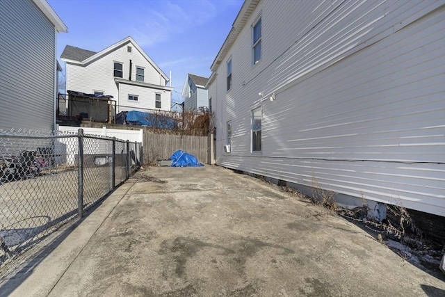 view of property exterior featuring fence