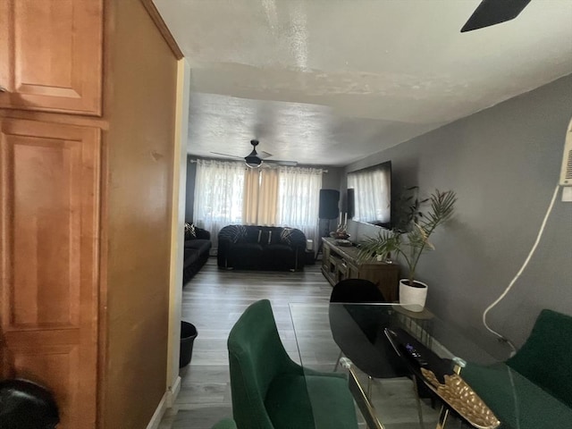 interior space with ceiling fan and light wood-type flooring