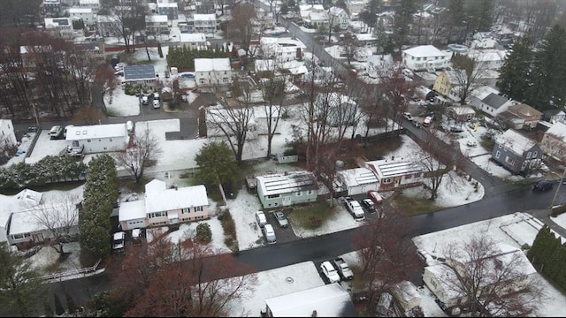 snowy aerial view featuring a residential view
