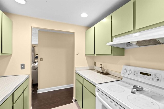 kitchen with light countertops, white range with electric stovetop, green cabinets, and under cabinet range hood