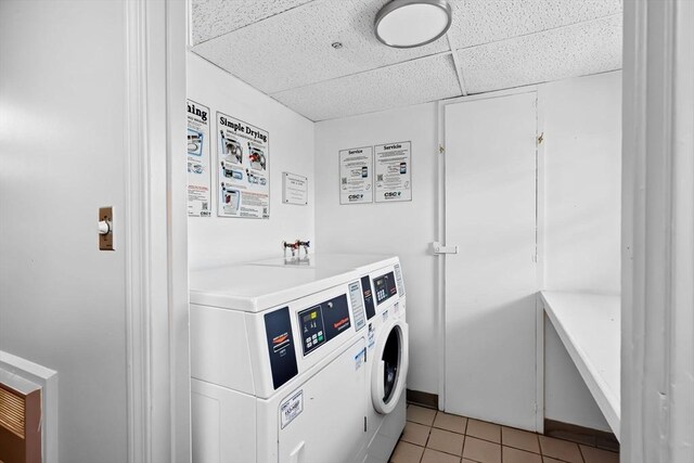 common laundry area featuring light tile patterned floors and independent washer and dryer
