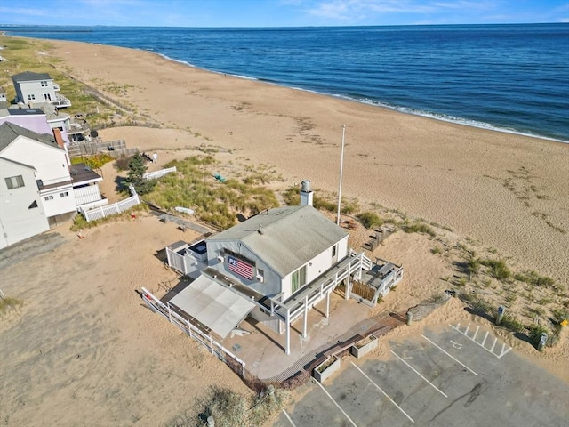 bird's eye view featuring a beach view and a water view