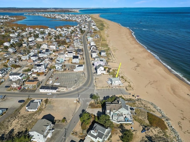 aerial view with a water view, a residential view, and a view of the beach