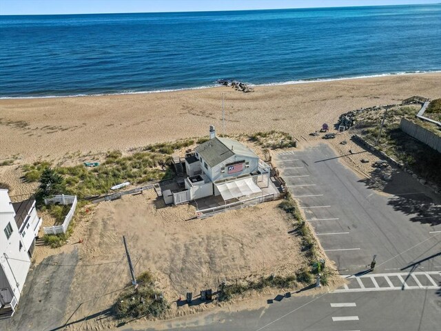 drone / aerial view with a view of the beach and a water view