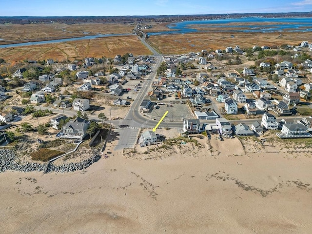 bird's eye view with a water view and a residential view