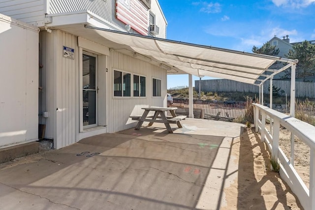 view of patio featuring fence