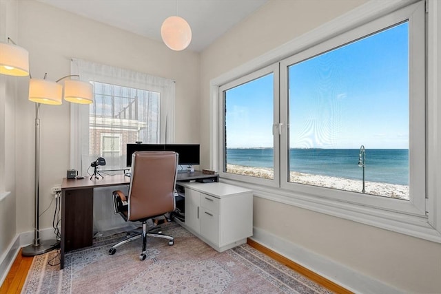 office area with light hardwood / wood-style floors