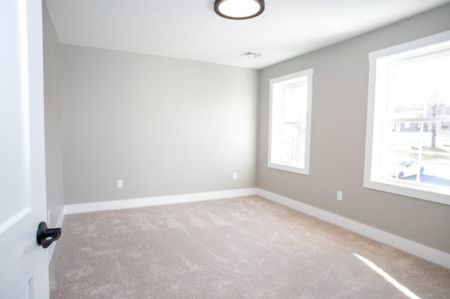 empty room with carpet flooring and baseboards