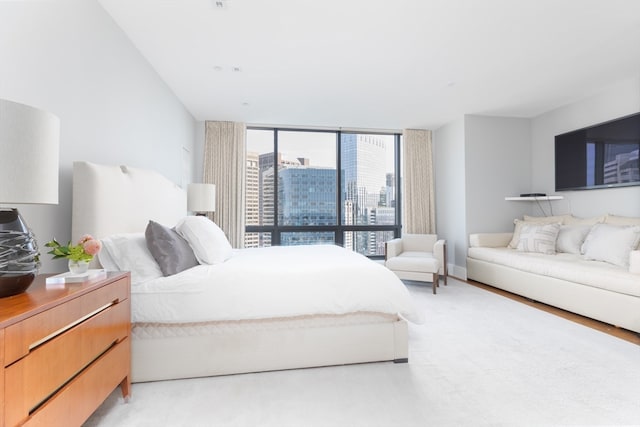 bedroom with floor to ceiling windows