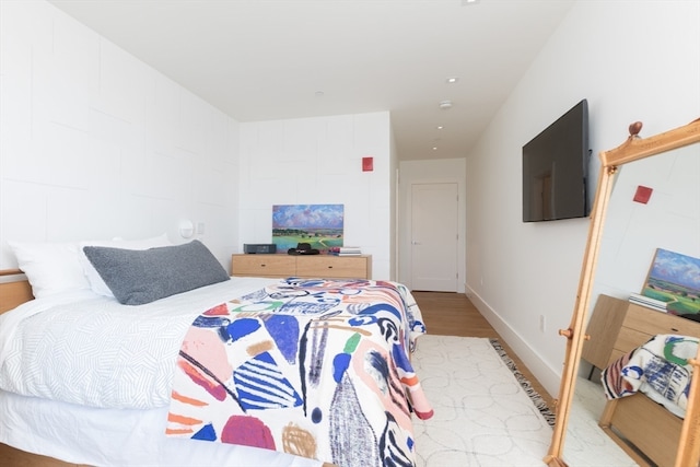 bedroom featuring light wood-type flooring