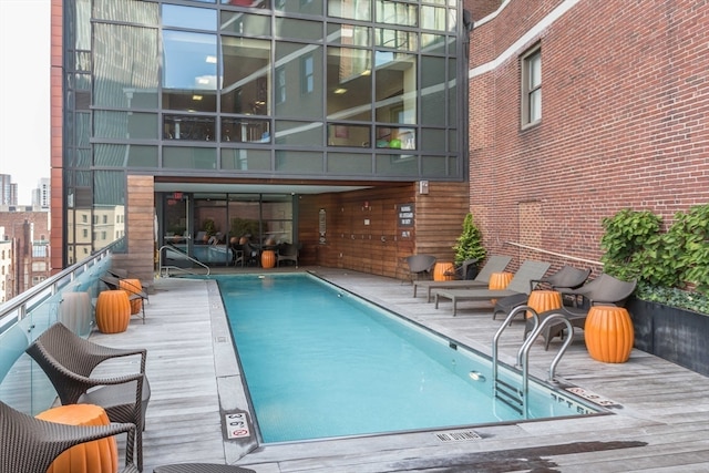 view of swimming pool with a wooden deck