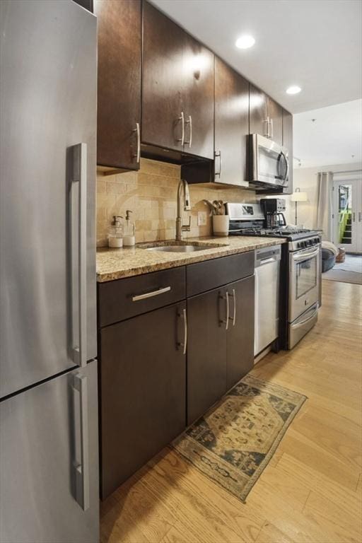 750 E 4th Unit 1, Boston, MA 02127 - kitchen featuring appliances with stainless steel finishes, a sink, dark brown cabinets, tasteful backsplash, and recessed lighting