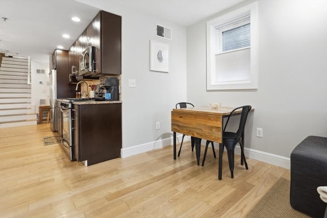 750 E 4th Unit 1, Boston, MA 02127 - kitchen featuring stainless steel appliances, dark brown cabinets, light wood-style flooring, baseboards, and recessed lighting