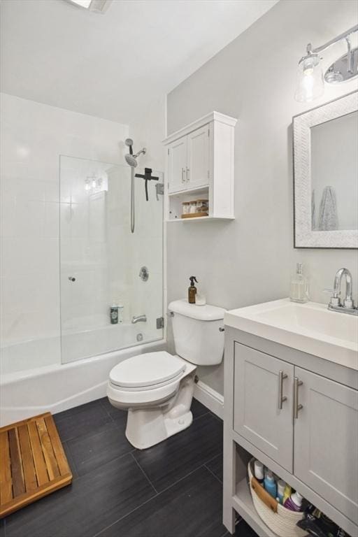 750 E 4th Unit 1, Boston, MA 02127 - full bathroom with toilet, bathtub / shower combination, vanity, wood finished floors, and baseboards
