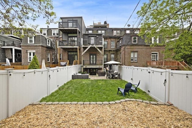 750 E 4th Unit 1, Boston, MA 02127 - rear view of property with brick siding and a gate