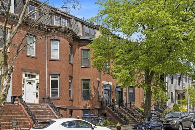 750 E 4th Unit 1, Boston, MA 02127 - multi unit property with brick siding, mansard roof, and stairway