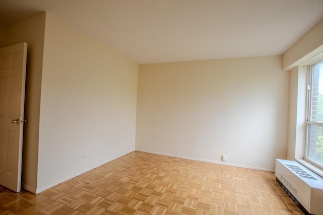 111 Perkins St Unit 42, Boston, MA 02130 - unfurnished room featuring radiator heating unit, healthy amount of natural light, and baseboards