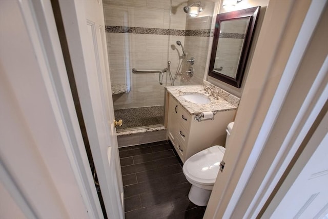 111 Perkins St Unit 42, Boston, MA 02130 - bathroom with tile patterned floors, toilet, a tile shower, and vanity