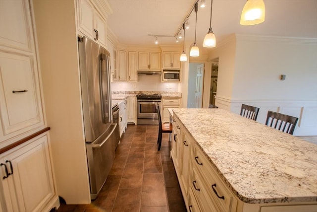 111 Perkins St Unit 42, Boston, MA 02130 - kitchen featuring stainless steel appliances, a large island, light stone countertops, a breakfast bar, and hanging light fixtures