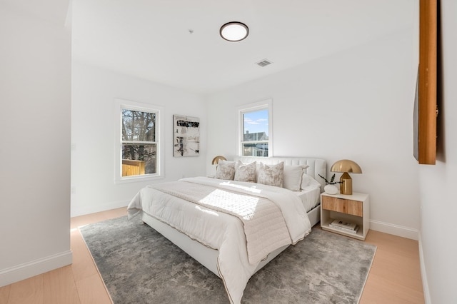 bedroom with light hardwood / wood-style floors