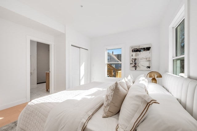 bedroom featuring a closet and light hardwood / wood-style floors