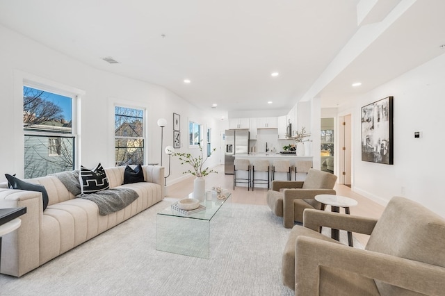 living room with light colored carpet