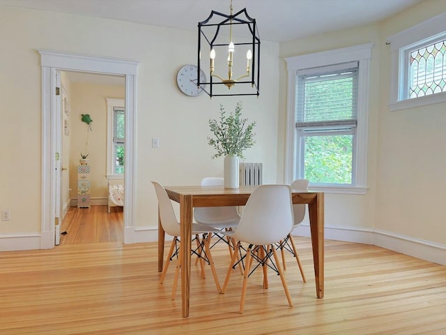 8 Fainwood Cir Unit 2, Cambridge, MA 02139 - dining area with light wood finished floors and a chandelier