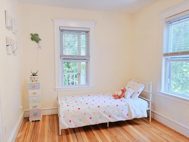 8 Fainwood Cir Unit 2, Cambridge, MA 02139 - bedroom featuring multiple windows and wood finished floors