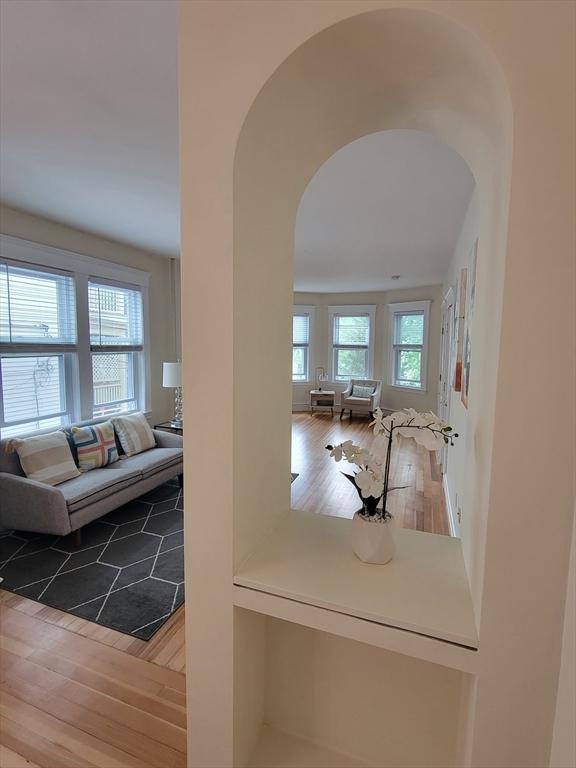 8 Fainwood Cir Unit 2, Cambridge, MA 02139 - corridor featuring arched walkways and wood finished floors