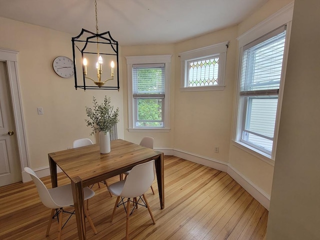 8 Fainwood Cir Unit 2, Cambridge, MA 02139 - dining area with light wood-type flooring and a chandelier