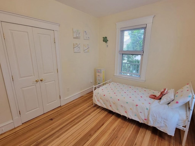 8 Fainwood Cir Unit 2, Cambridge, MA 02139 - bedroom with light wood-style floors and baseboards