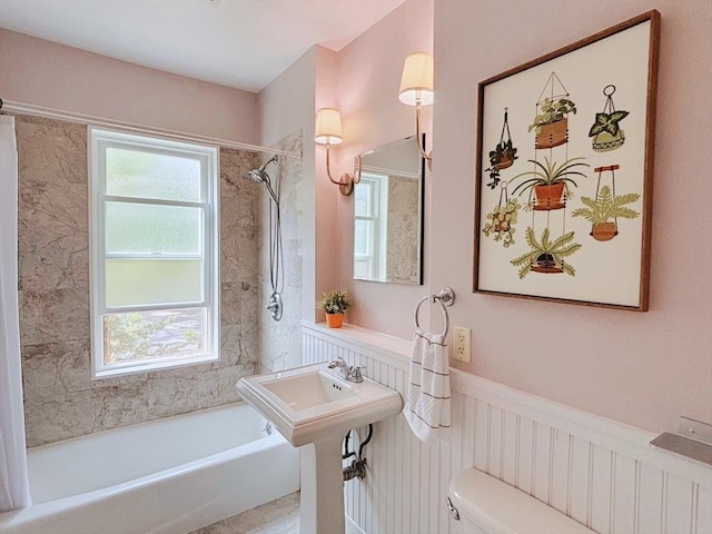 8 Fainwood Cir Unit 2, Cambridge, MA 02139 - bathroom with washtub / shower combination, a wainscoted wall, and plenty of natural light