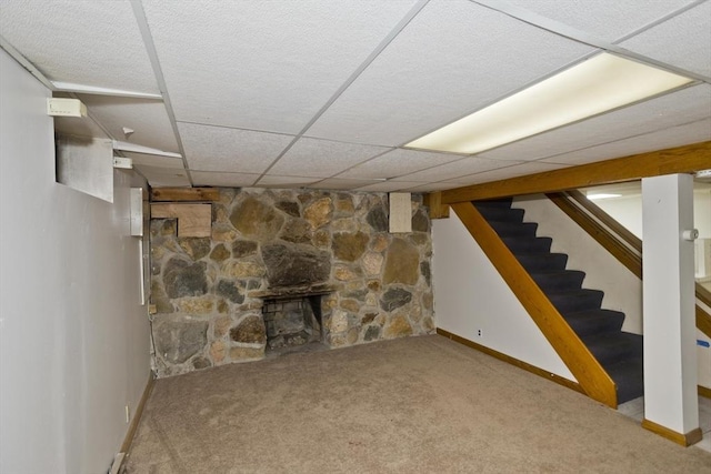 118 Woodland Rd, Springfield, MA 01129 - finished basement with carpet floors, stairway, a paneled ceiling, and a fireplace