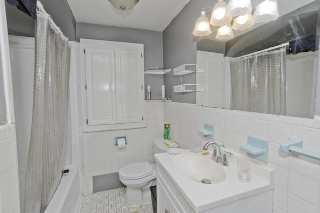 118 Woodland Rd, Springfield, MA 01129 - bathroom featuring vanity, a chandelier, tile walls, tile patterned flooring, and shower / bath combination with curtain