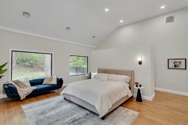 bedroom with baseboards, light wood-type flooring, recessed lighting, and high vaulted ceiling