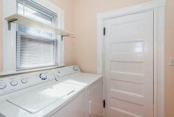 clothes washing area with laundry area and separate washer and dryer