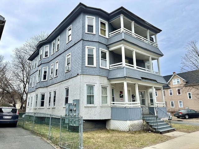 403 Orange St, Springfield, MA 01108 - view of front of property featuring fence, a porch, and a balcony