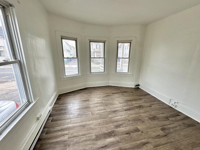 403 Orange St, Springfield, MA 01108 - unfurnished room with a wealth of natural light, dark wood-style floors, and baseboards