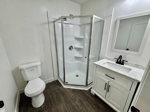 403 Orange St, Springfield, MA 01108 - bathroom with vanity, wood finished floors, a shower stall, and toilet