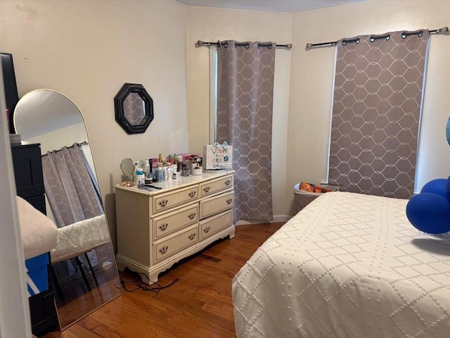 bedroom featuring dark wood-style floors