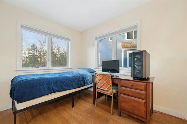 bedroom with hardwood / wood-style floors