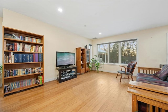 sitting room featuring light hardwood / wood-style floors